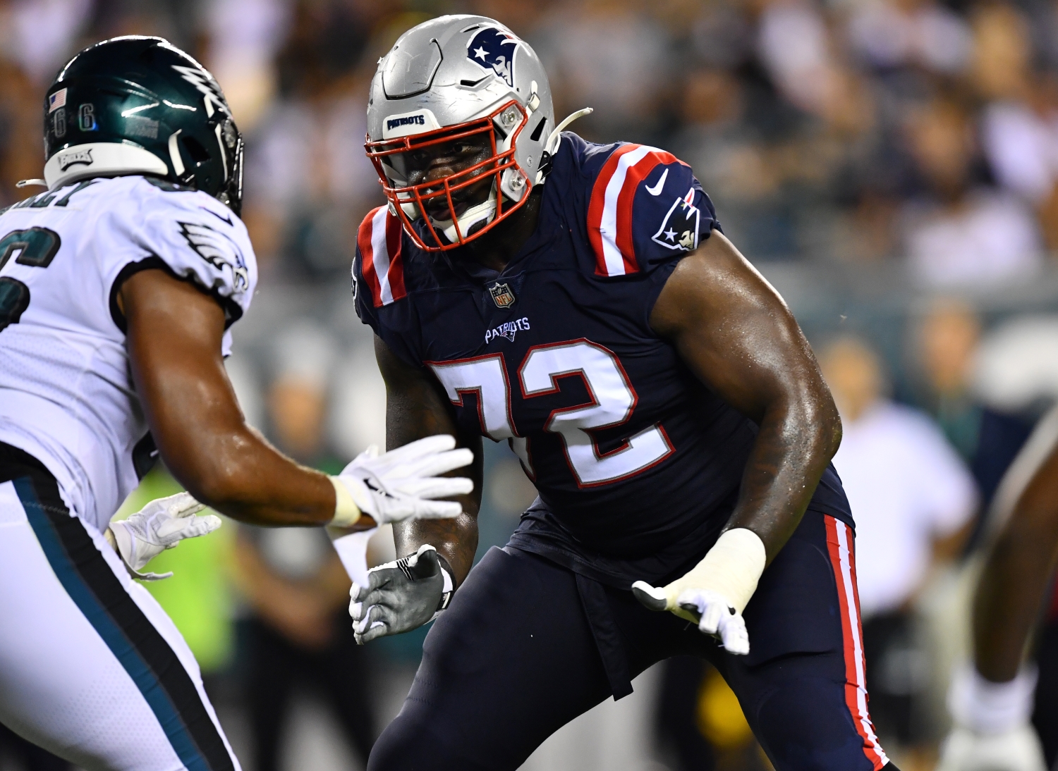 New England Patriots offensive tackle Yodny Cajuste gets ready to block a Philadelphia Eagles defender.