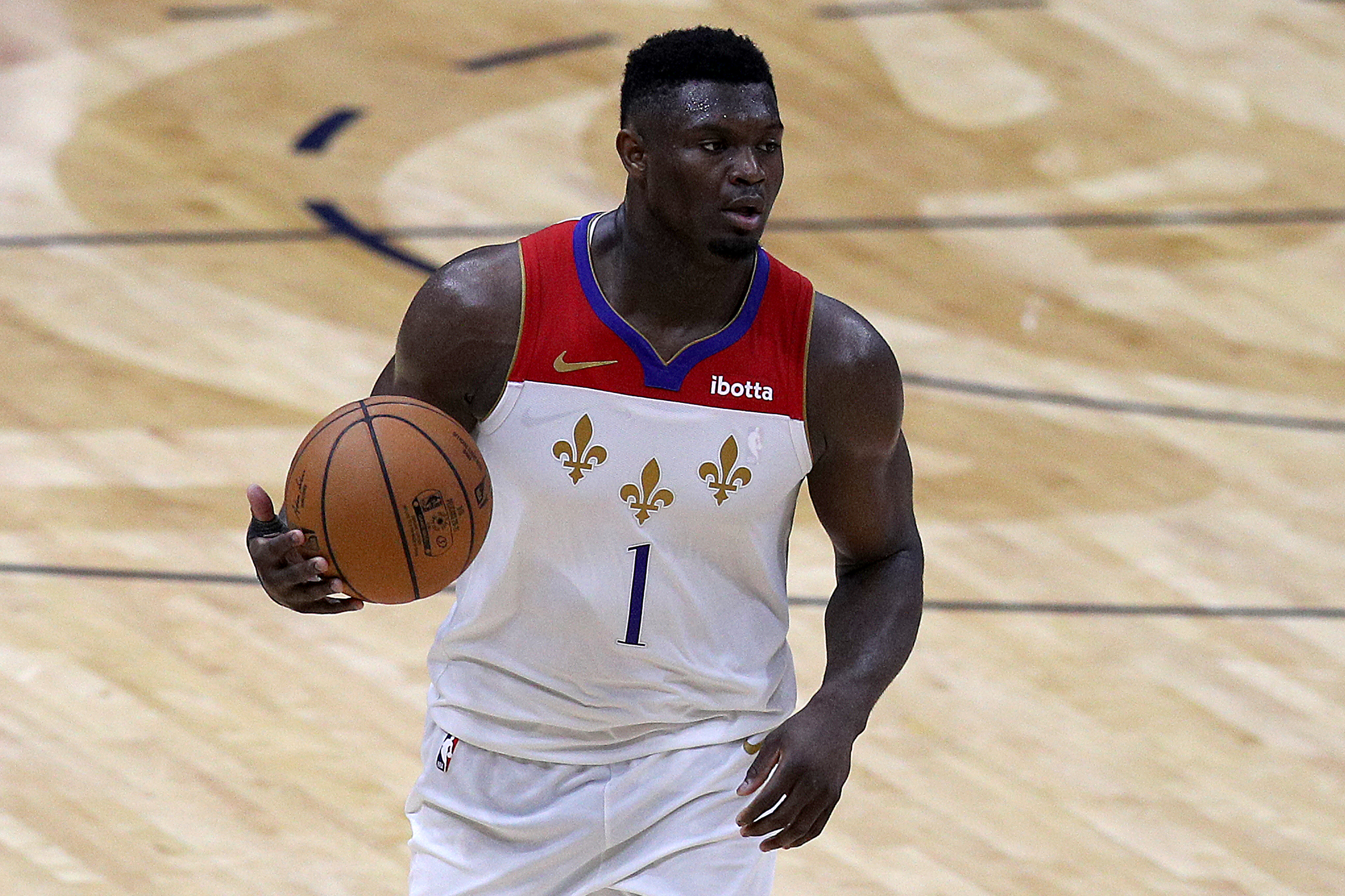 New Orleans Pelicans star Zion Williamson dribbles up the floor during a game in May