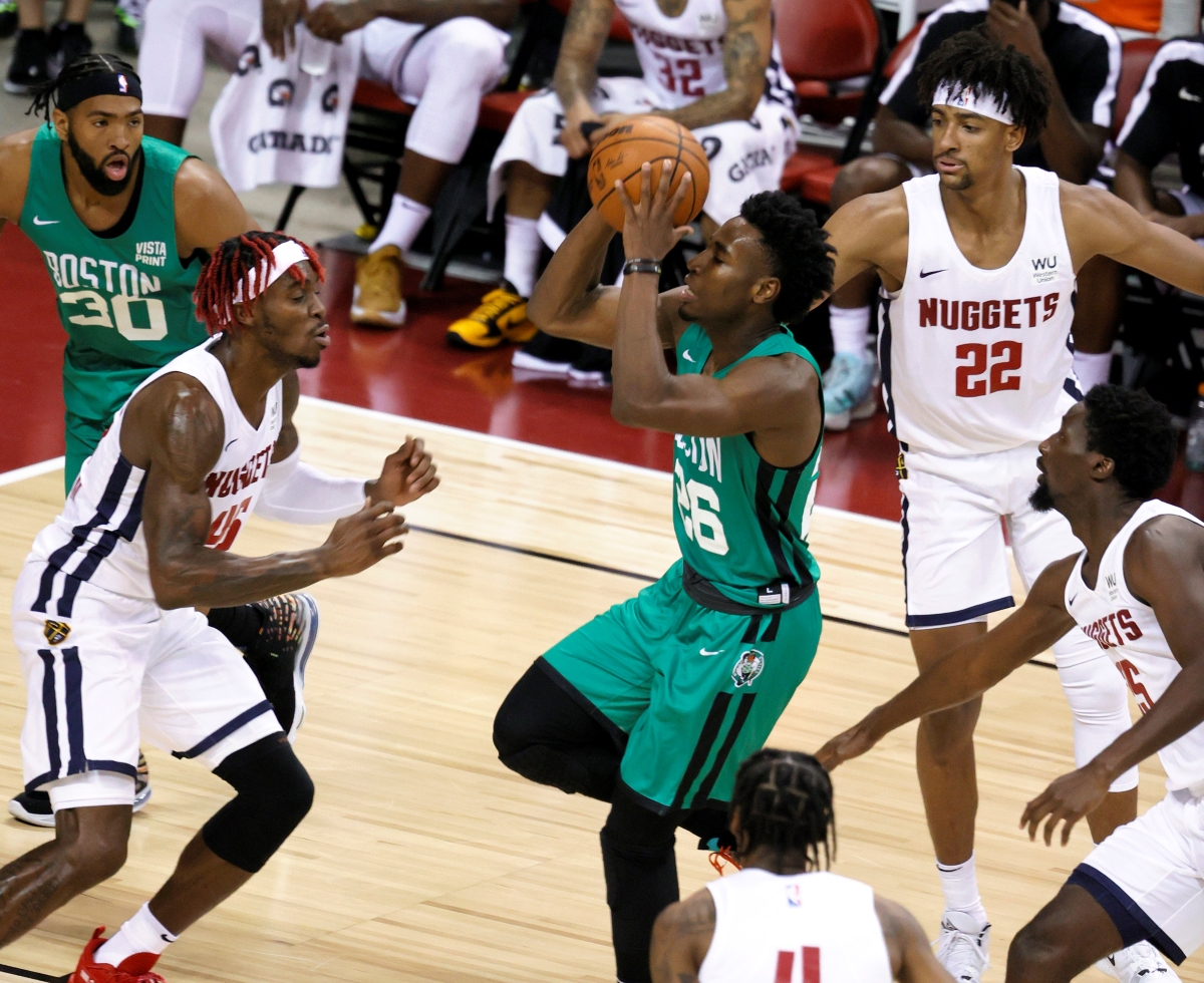 The Boston Celtics' Aaron Nesmith drives to the basket during an NBA Las Vegas Summer League game.