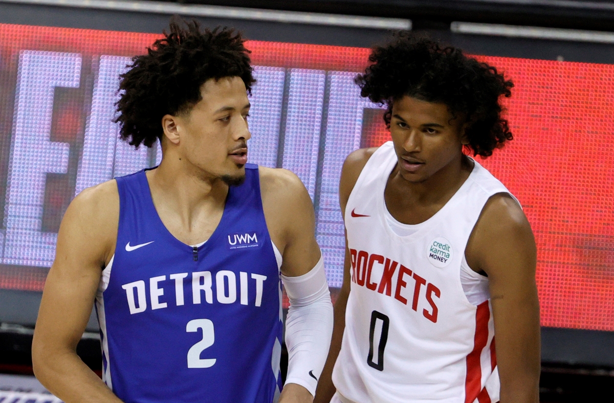 Cade Cunningham of the Detroit Pistons and Jalen Green of the Houston Rockets chat before an NBA summer league game.