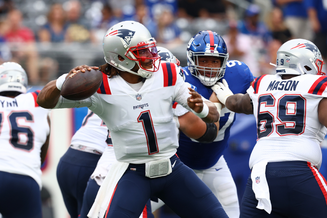 Cam Newton of the New England Patriots looks to pass.