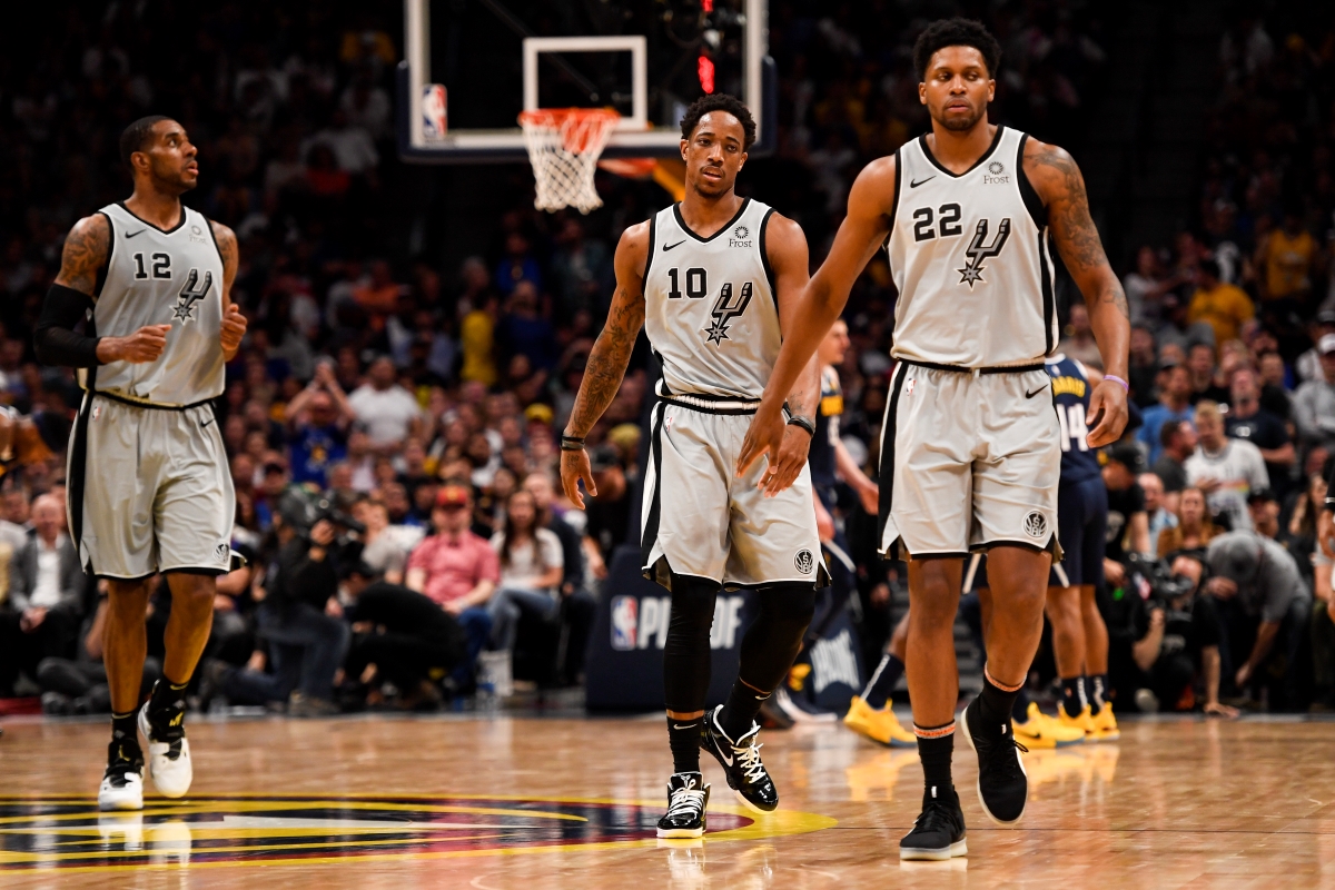 DeMar DeRozan, Rudy Gay, and LaMarcus Aldridge walk off the court in frustration