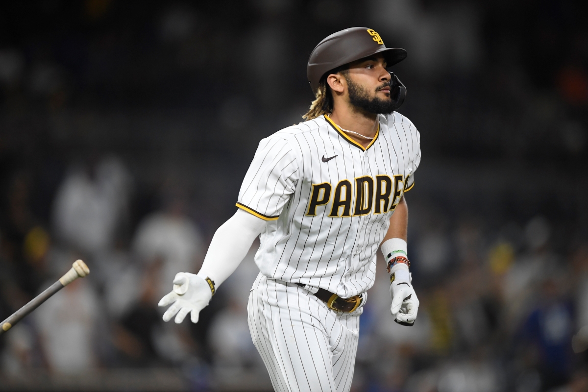 Fernando Tatis Jr. of the San Diego Padres hits a two-run home run during the 15th inning of a baseball game against the Los Angeles Dodgers.