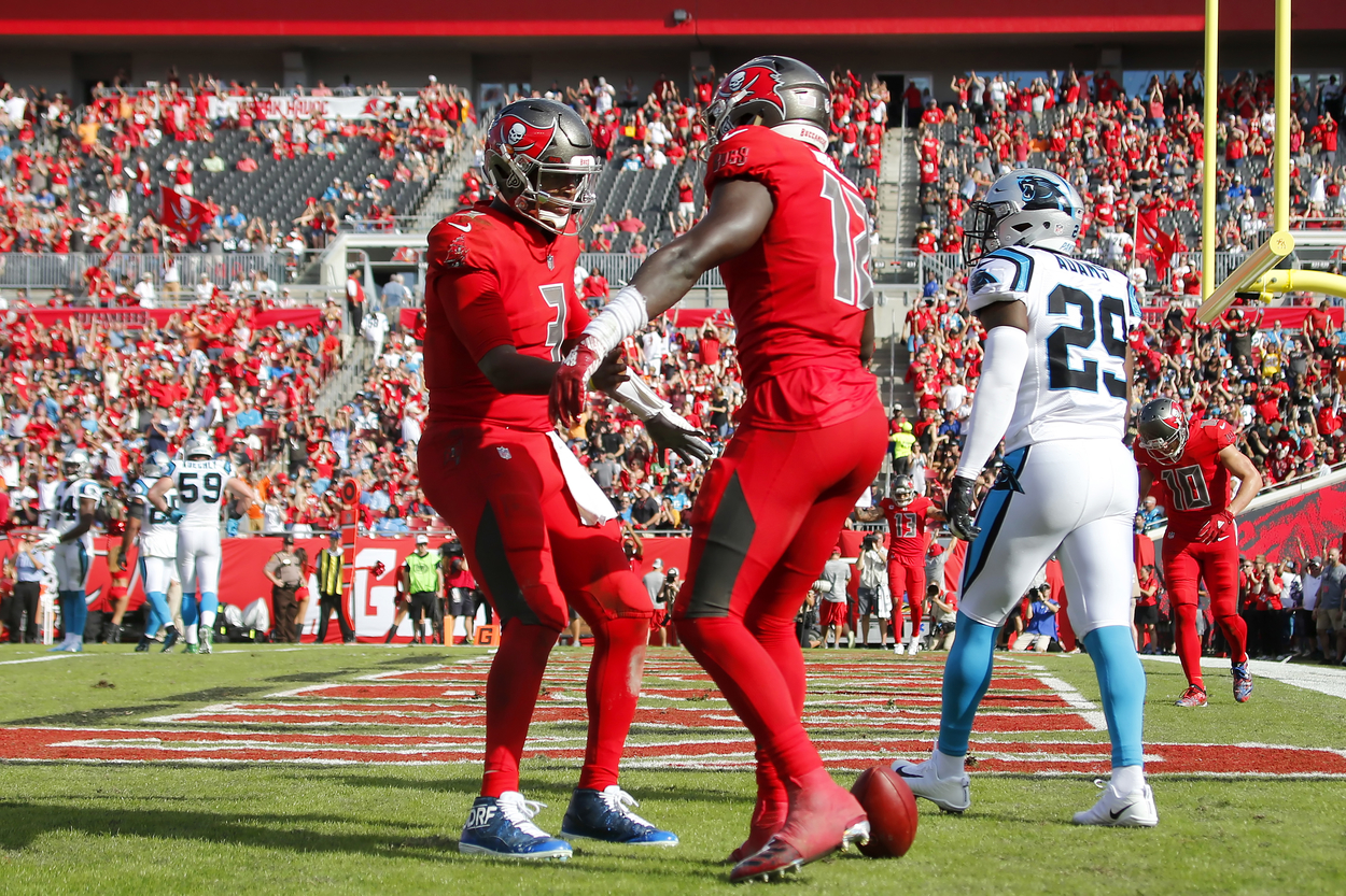 Jameis Winston meets his receiver Chris Godwin in the end zone after the two linked up for a touchdown.
