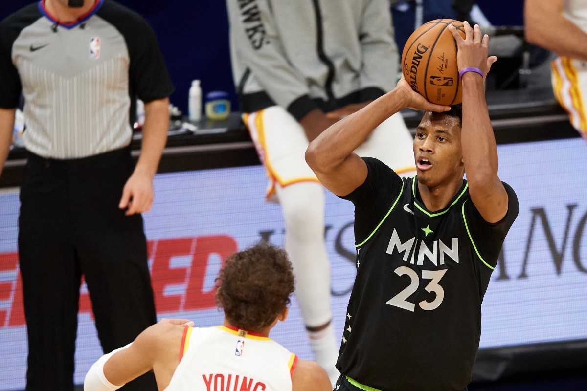 Jarrett Culver of the Minnesota Timberwolves, recently traded to the Memphis Grizzlies, shoots over the Atlanta Hawks' Trae Young.