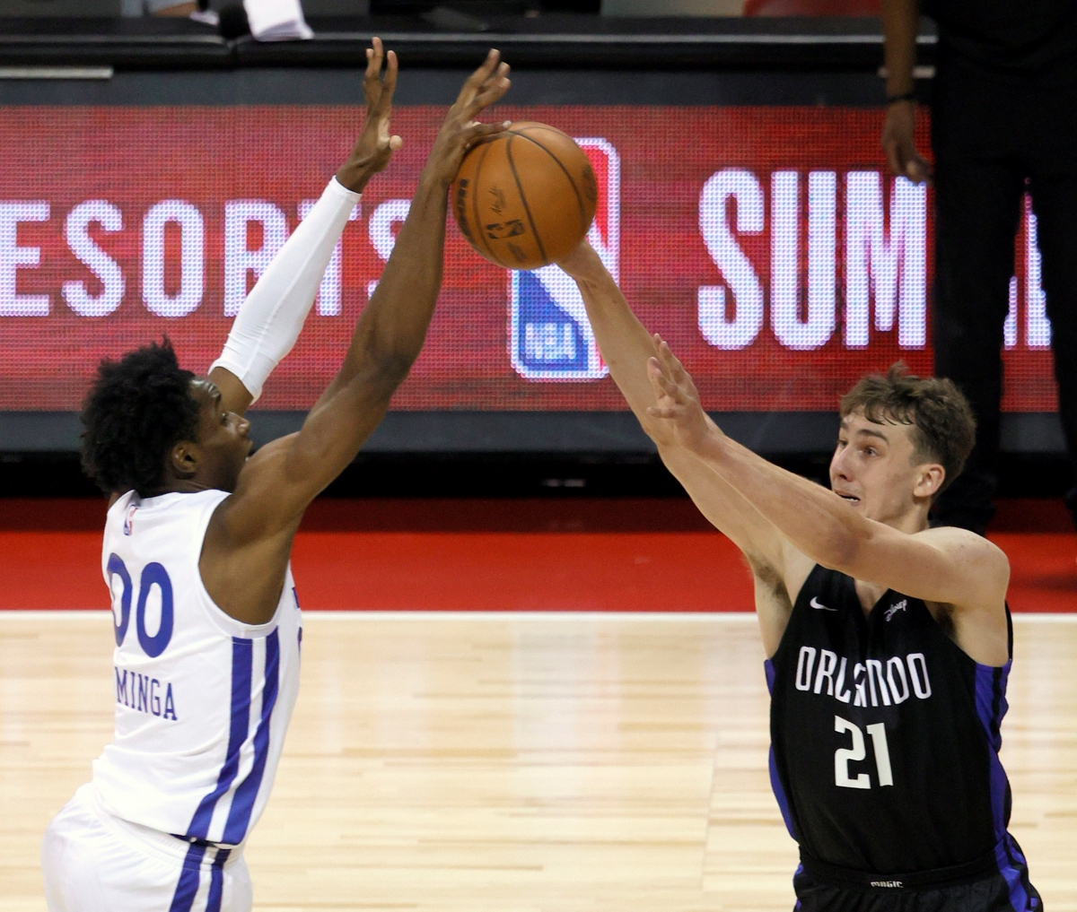 Jonathan Kuminga of the Golden State Warriors blocks a shot by the Orlando Magic's Franz Wagner at the 2021 NBA Summer League.