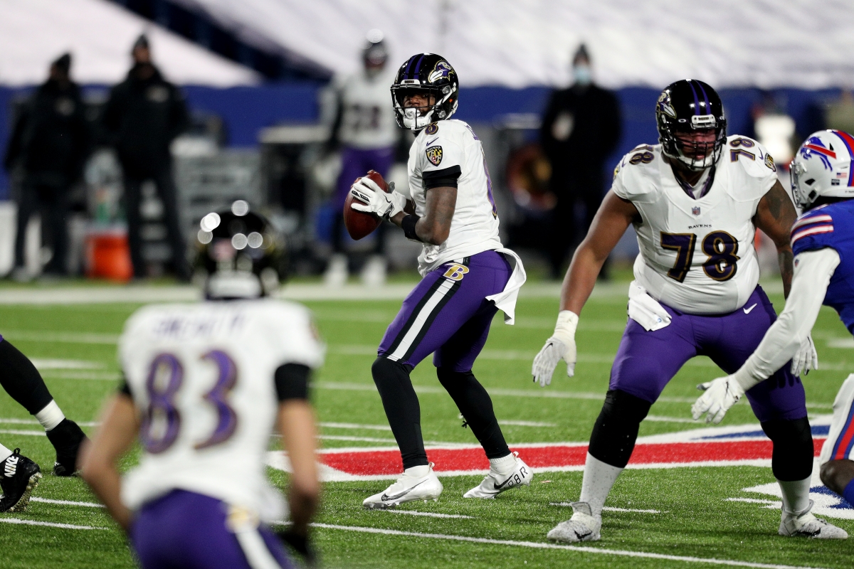 Lamar Jackson of the Baltimore Ravens drops back to pass in a game against the Buffalo Bills.