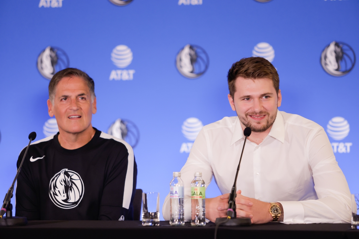 Dallas Mavericks' guard Luka Doncic and owner Mark Cuban speak at a press conference.