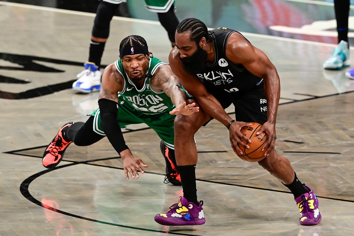 Marcus Smart of the Boston Celtics defends James Harden of the Brooklyn Nets.