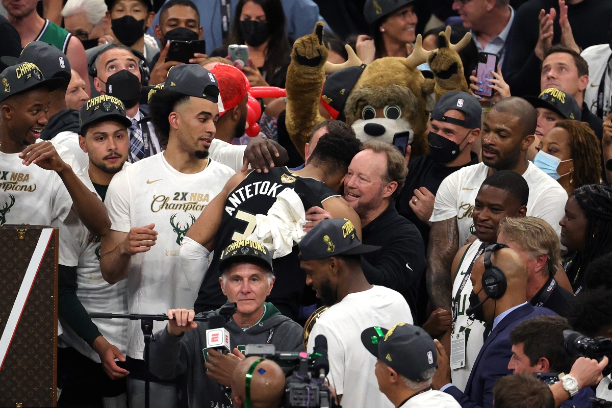 Milwaukee Bucks Head Coach Mike Budenholzer, who received a 3-year contract extension with the team, embraces Giannis Antetokounmpo after Milwaukee won the 2021 NBA Championship.