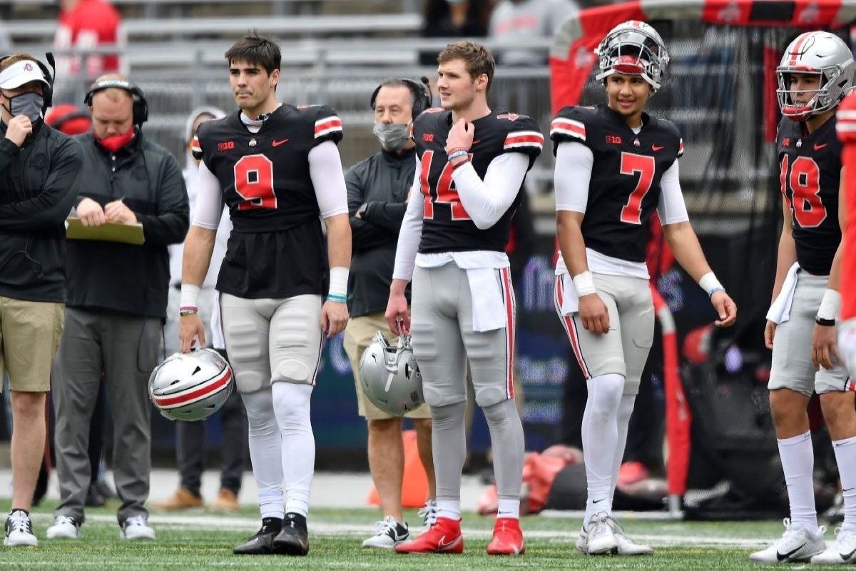 Ohio State's Jack Miller III, C.J. Stroud and Kyle McCord watch their teammates from the sidelines during Ohio State's Spring Game.