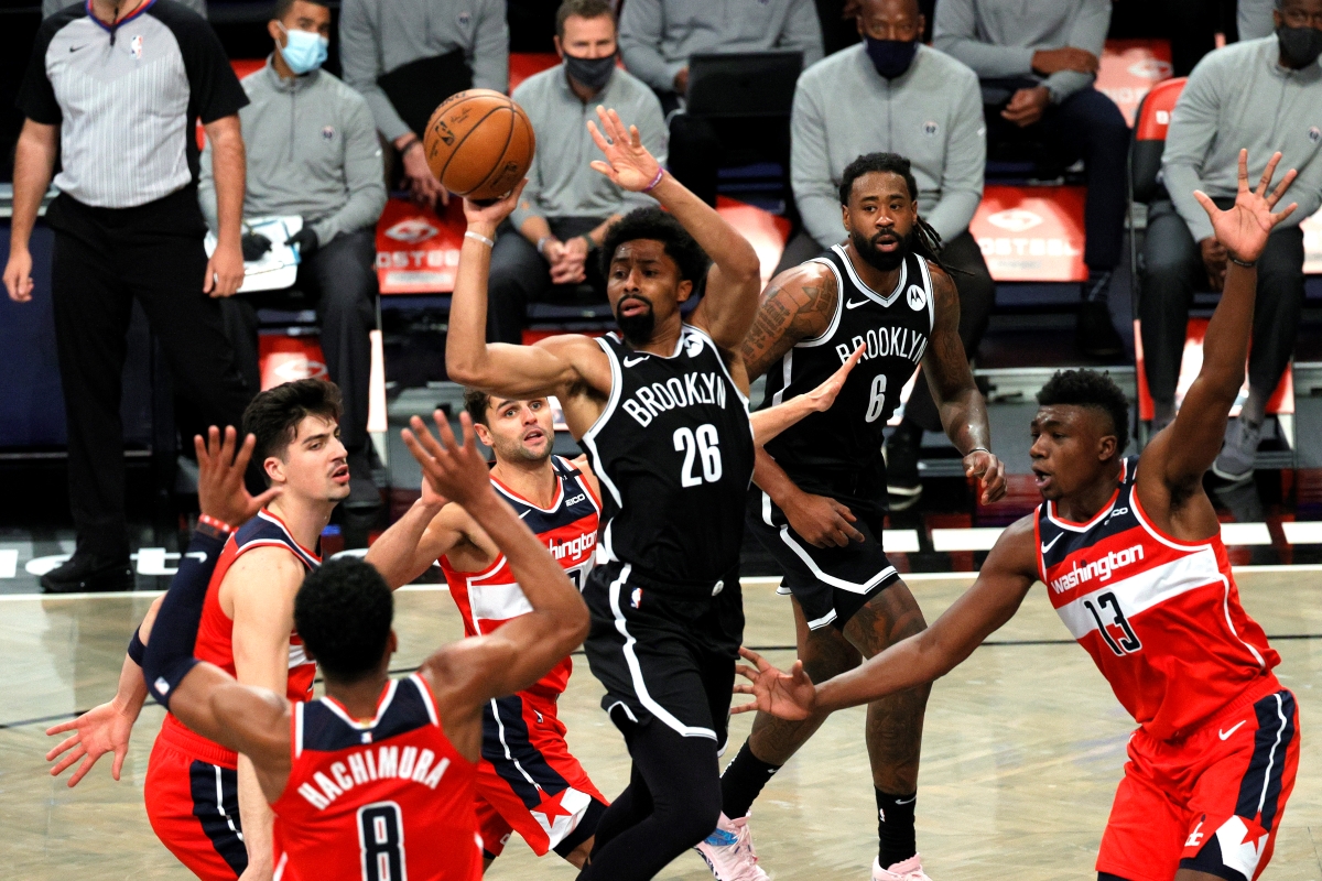 Spencer Dinwiddie of the Brooklyn Nets makes a pass in a game against the Washington Wizards.