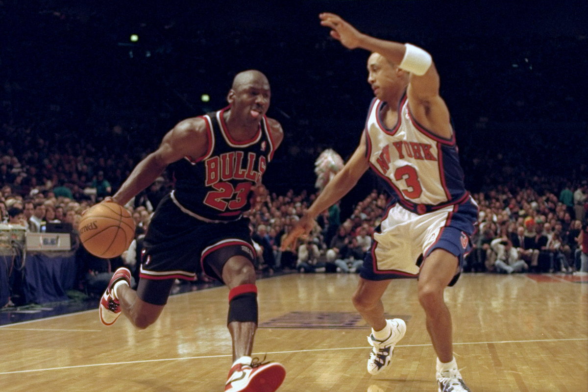 Michael Jordan tries to get around John Starks
