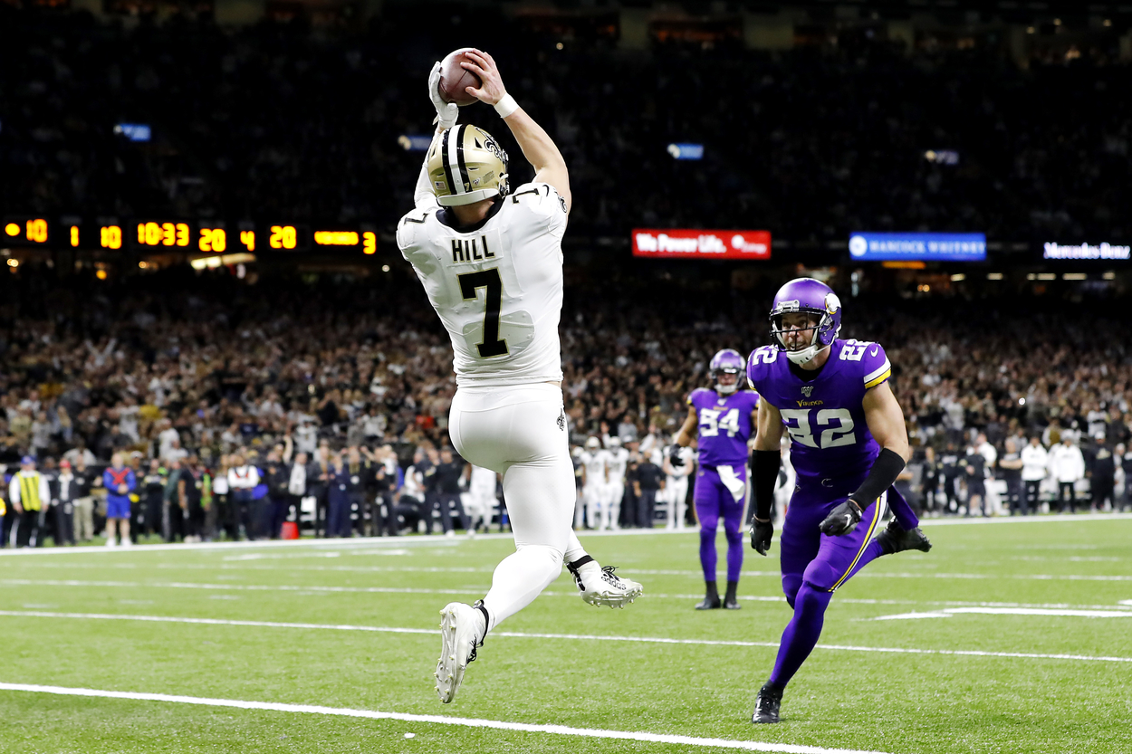 Taysom Hill leaps up to make a touchdown catch for the Saints.