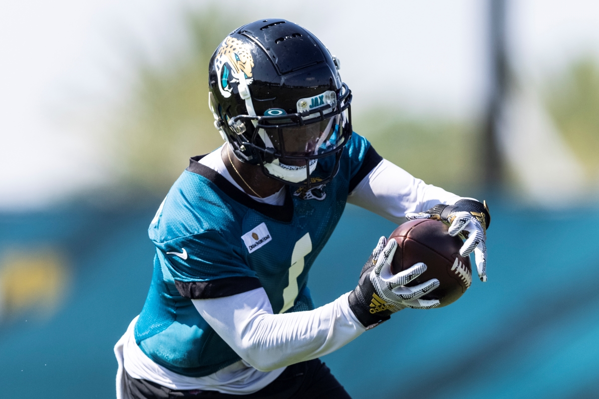 Jacksonville Jaguars' rookie running back Travis Etienne catches a pass during training camp.