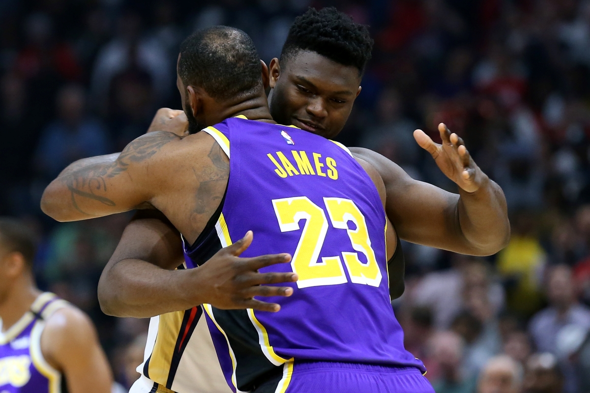 Zion Williamson of the New Orleans Pelicans and LeBron James of the Los Angeles Lakers hug during pregame warmups.