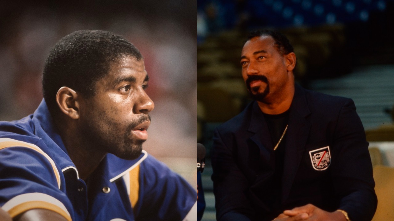 Los Angeles Lakers point guard Magic Johnson watches an NBA game on the bench as Wilt Chamberlain sits on the sideline