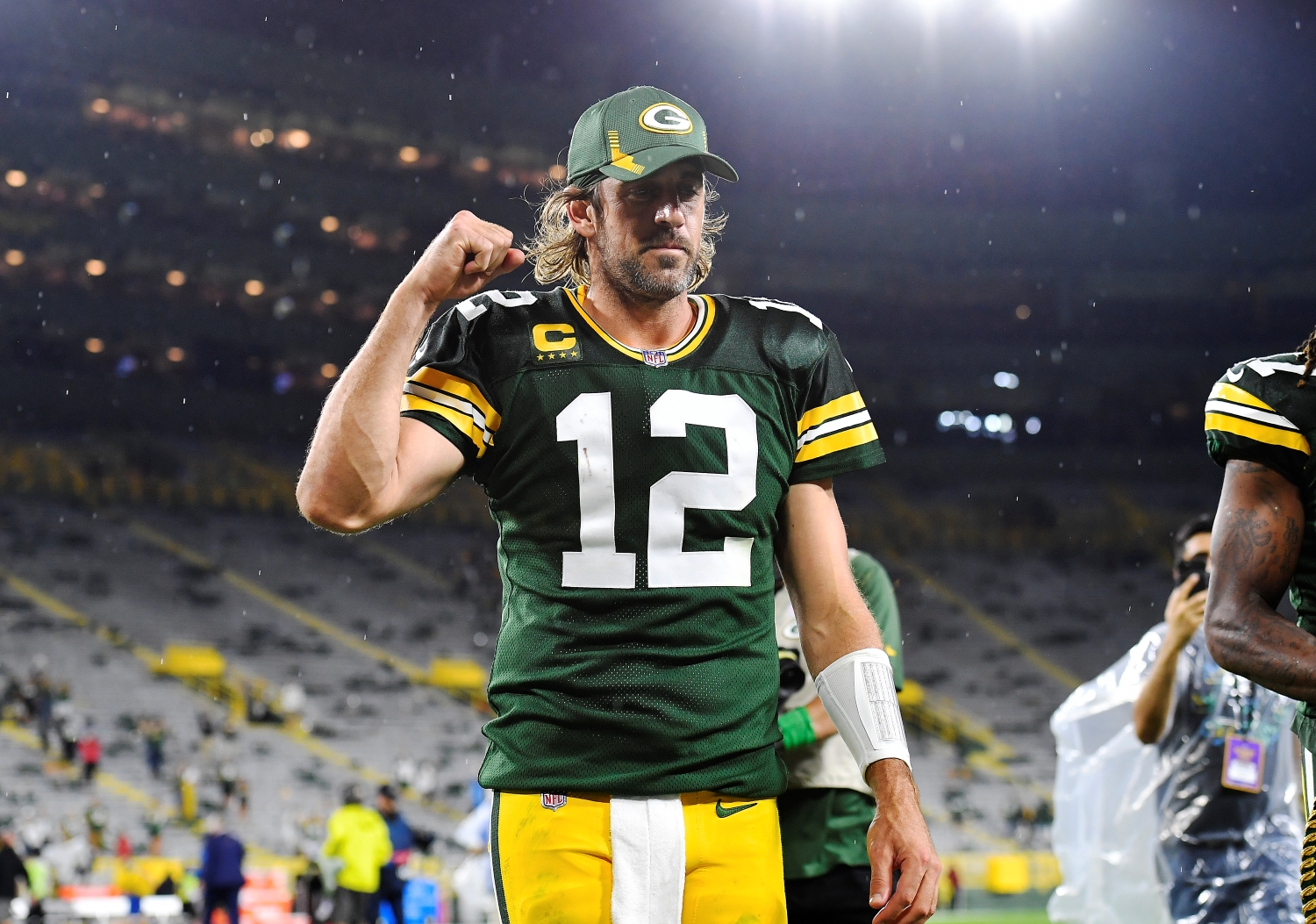 Aaron Rodgers pumps his fist in the air after winning a Monday Night Football matchup against the Detroit Lions.