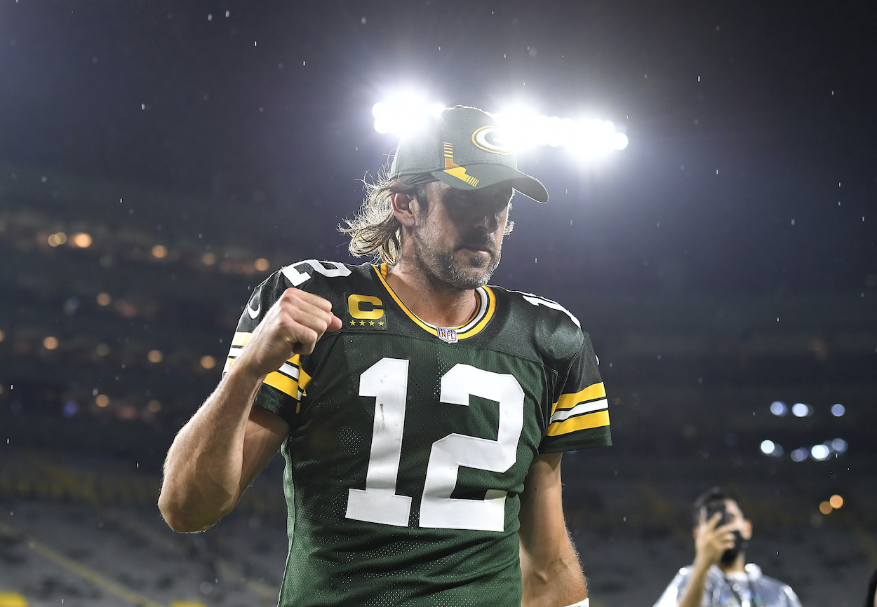 Aaron Rodgers of the Green Bay Packers reacts as he walks of the field following the team's win against the Detroit Lions during an NFL football game at Lambeau Field on September 20, 2021 in Green Bay, Wisconsin.