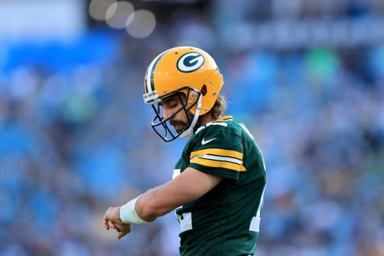 Aaron Rodgers of the Green Bay Packers looks at his play chart during the game against the New Orleans Saints at TIAA Bank Field on September 12, 2021 in Jacksonville, Florida.