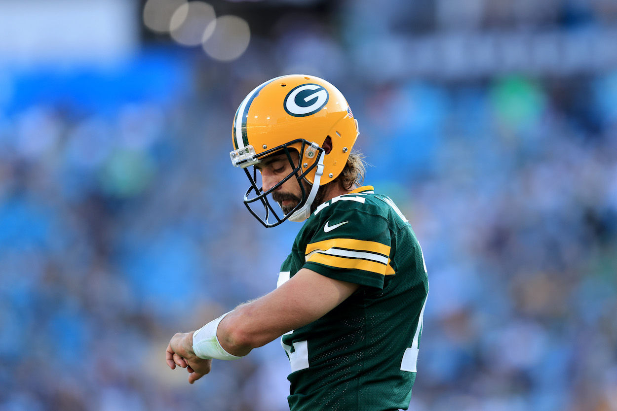 Aaron Rodgers of the Green Bay Packers looks at his play chart during the game against the New Orleans Saints at TIAA Bank Field on September 12, 2021 in Jacksonville, Florida.