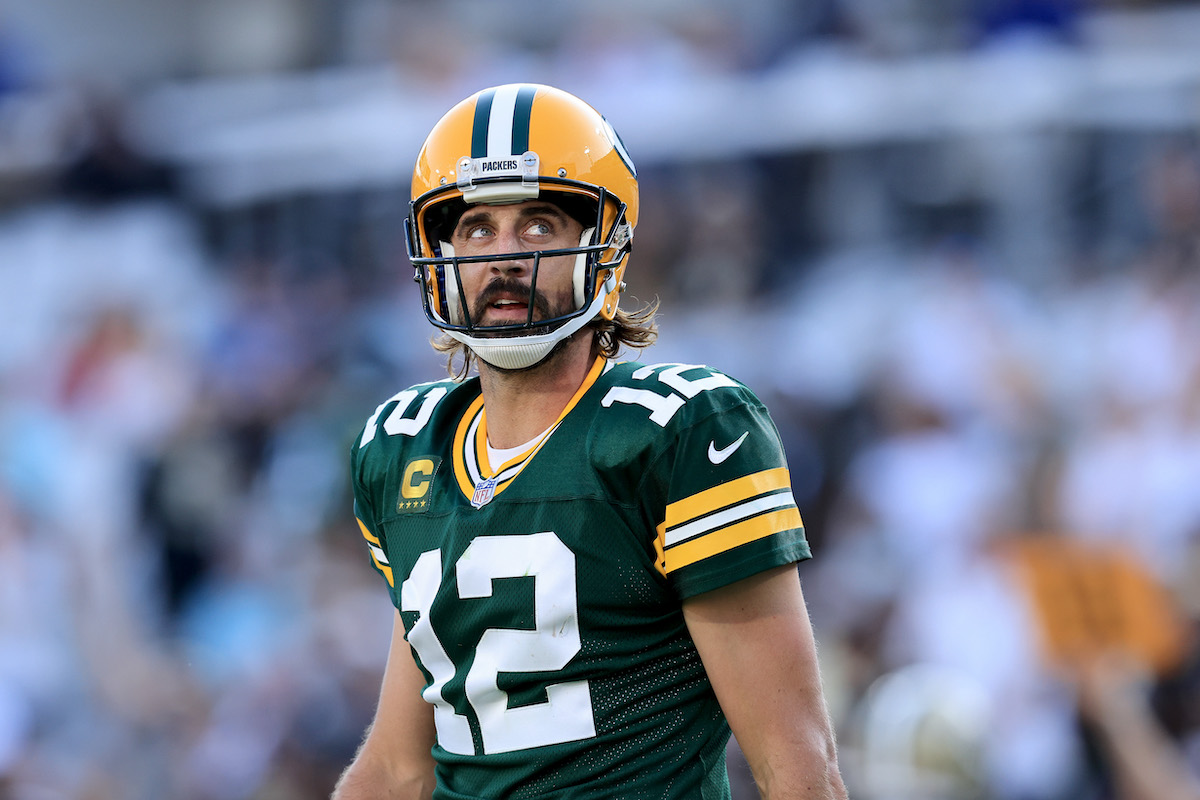 Aaron Rodgers of the Green Bay Packers looks toward the scoreboard during a game