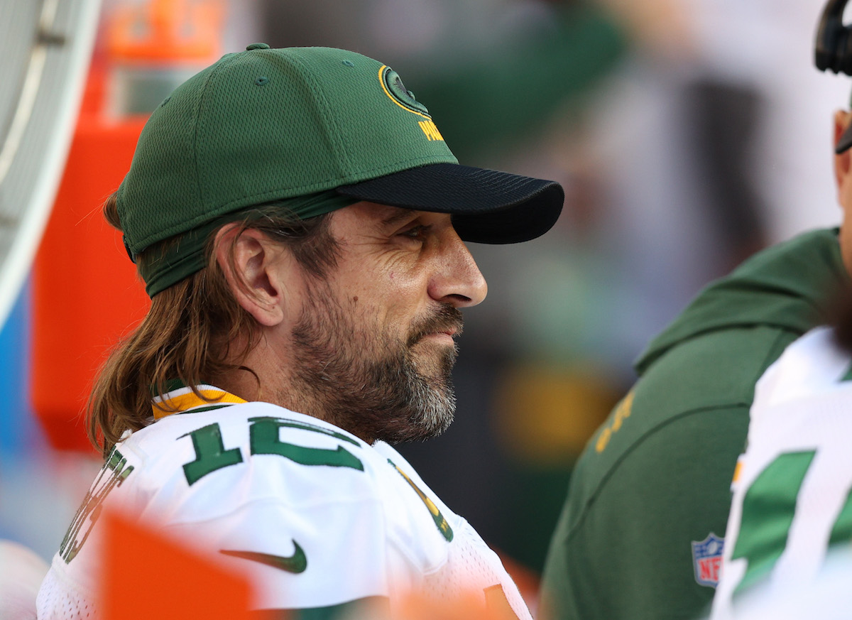 Aaron Rodgers of the Green Bay Packers sits on the bench