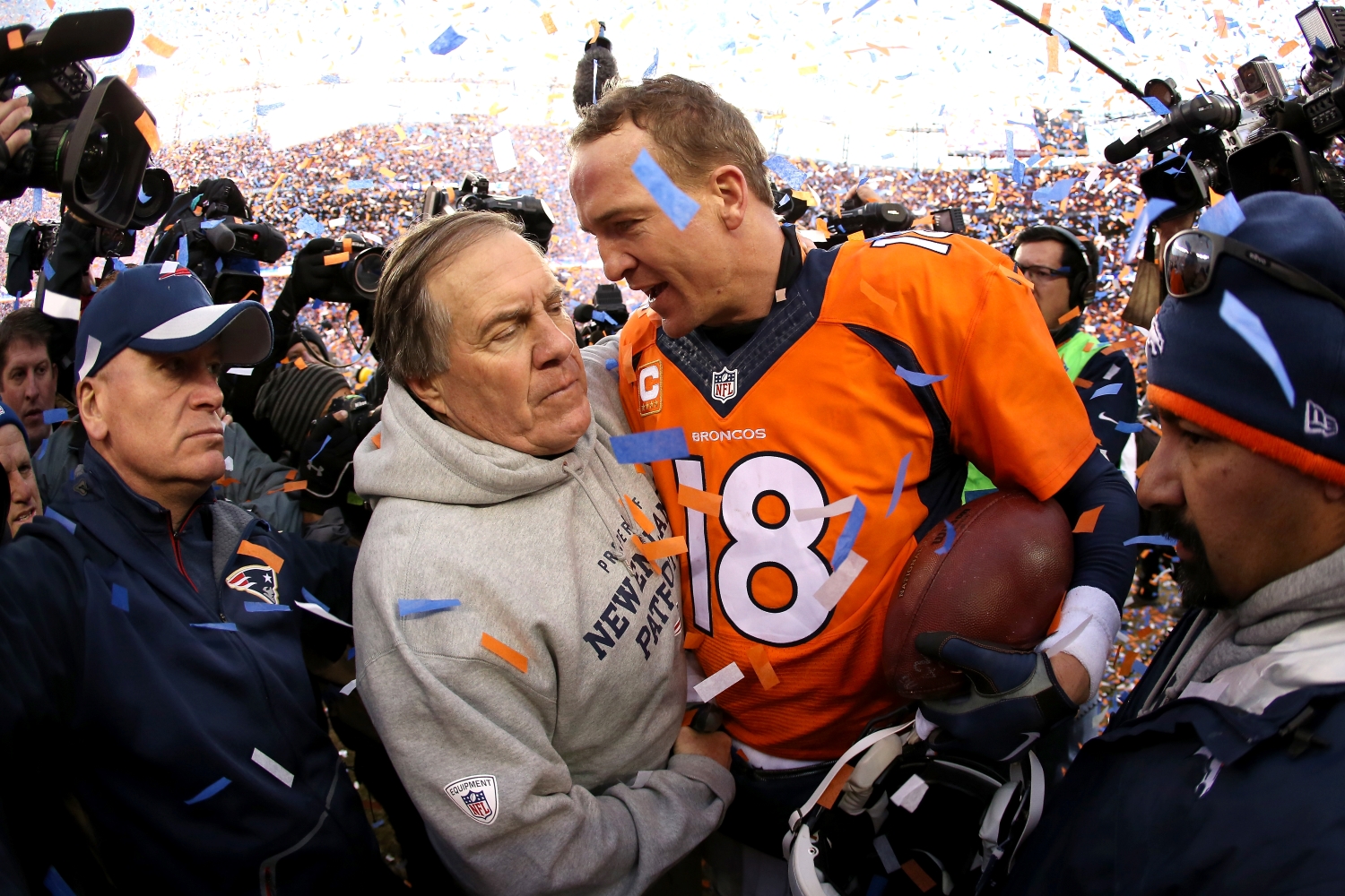 New England Patriots head coach Bill Belichick shakes hands with Denver Broncos quarterback Peyton Manning after the AFC Championship.