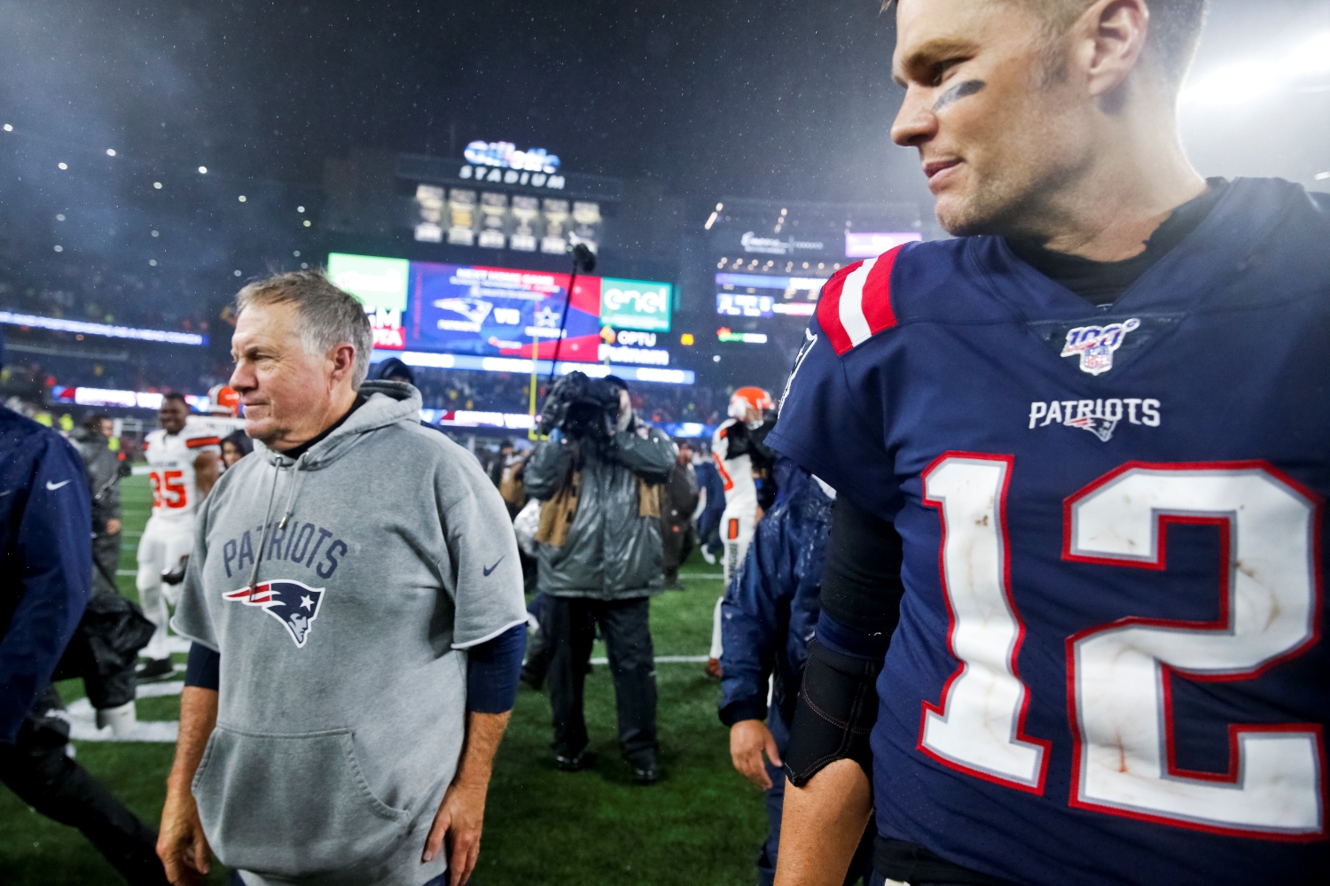 Bill Belichick and Tom Brady walk off the field after a 2019 game between the Patriots and the Browns.