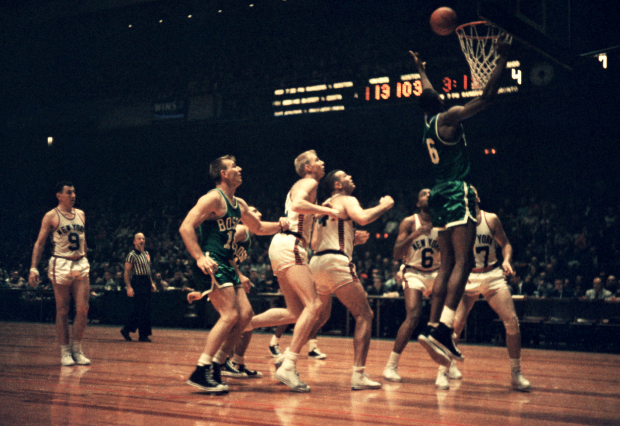 Bill Russell #6 of the Boston Celtics shoots the layup.
