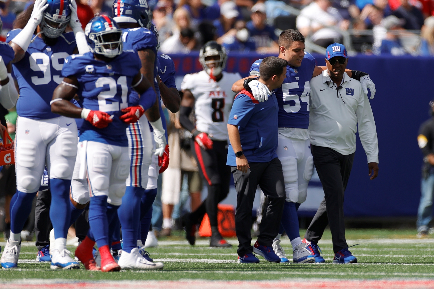 New York Giants linebacker Blake Martinez is helped off the field after suffering an injury.
