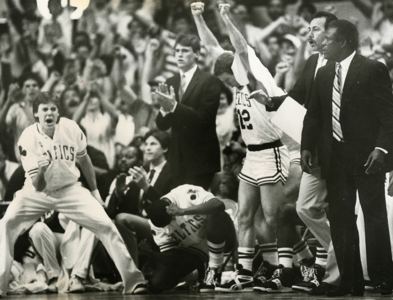 The Boston Celtics bench reacts to final Celtics points as Larry Bird steals the ball and passes to Dennis Johnson for the winning basket against the Detroit Pistons in 1987.