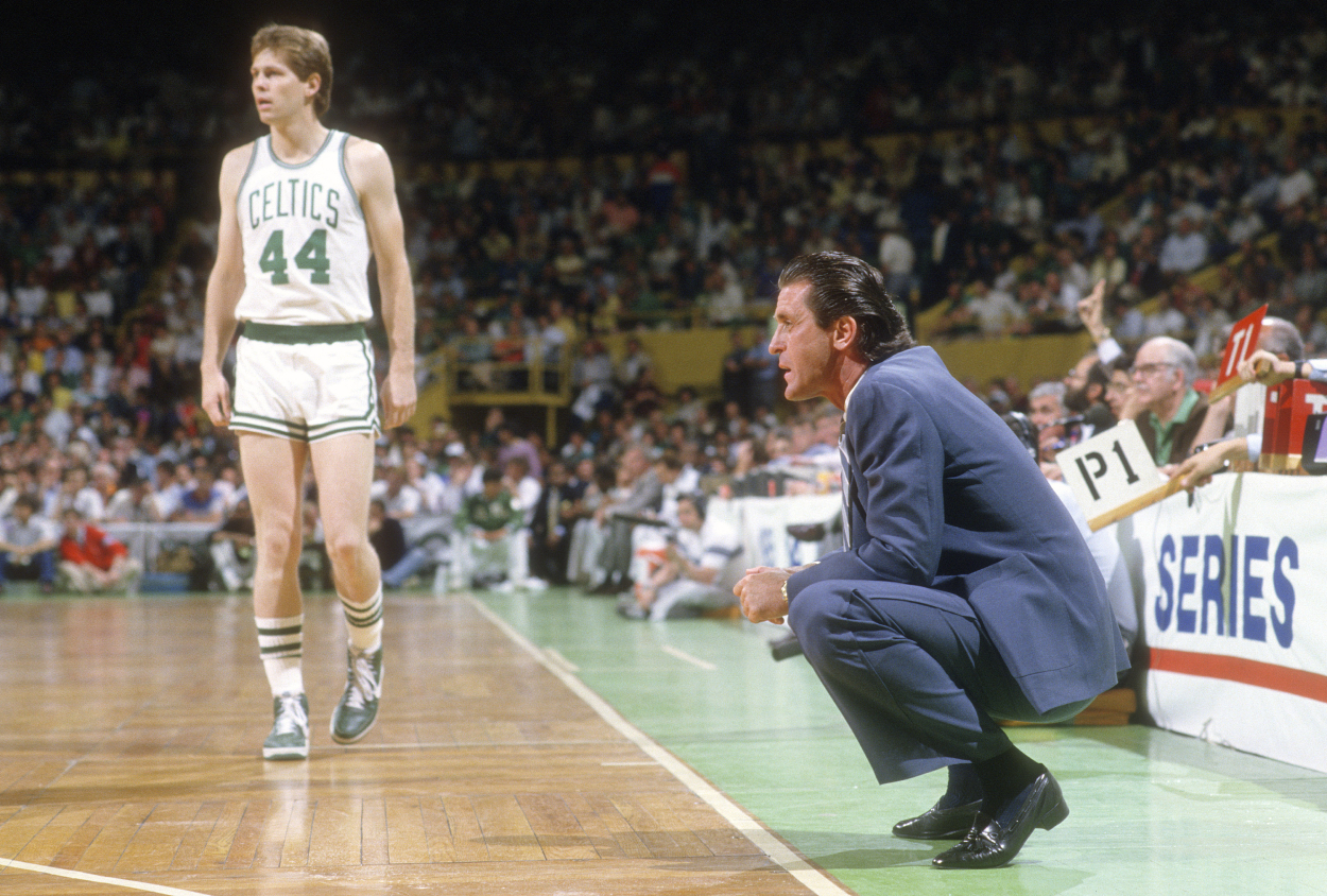 Head Coach Pat Riley of the Los Angeles Lakers looks on against the Boston Celtics during an NBA basketball game circa 1984.