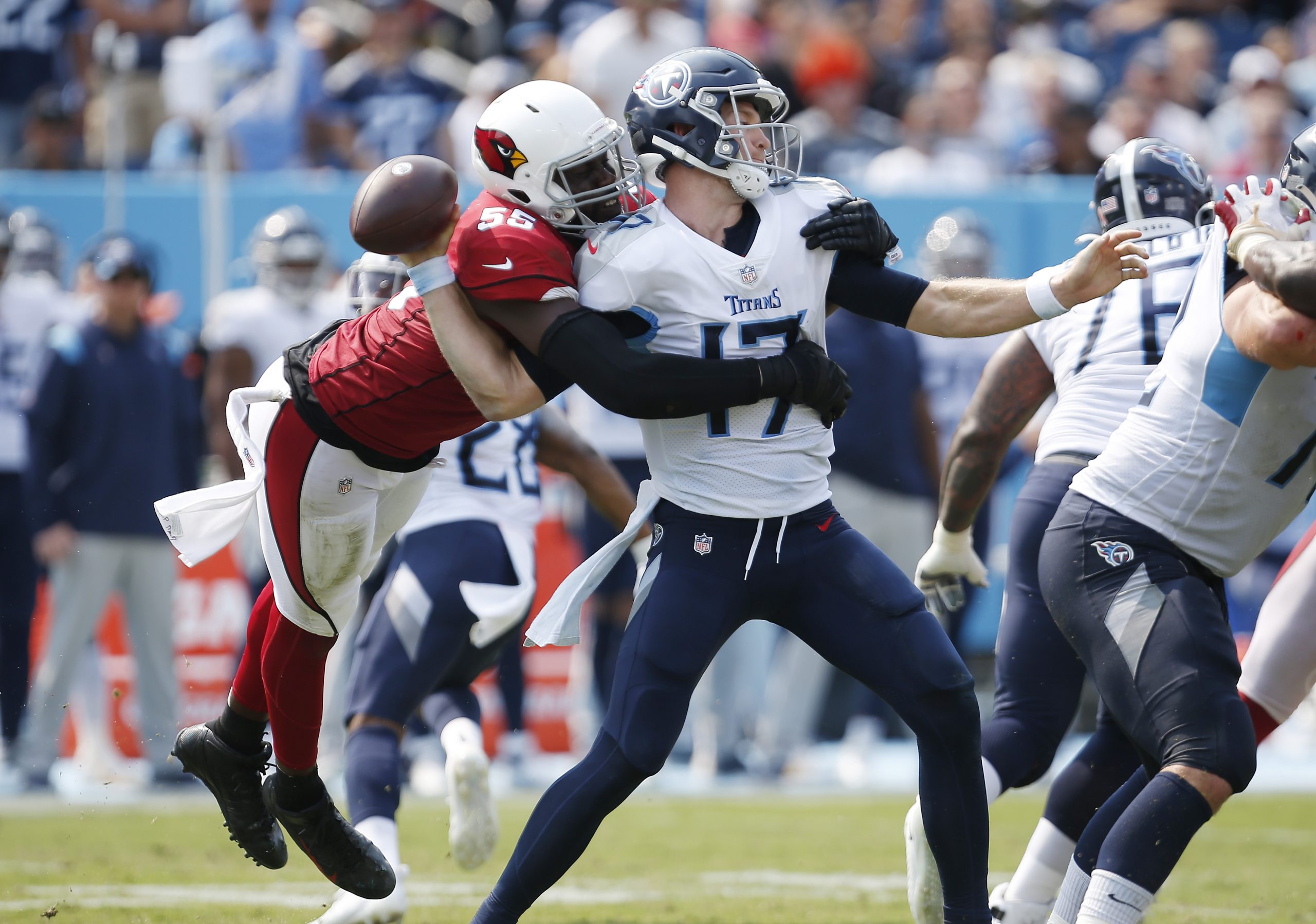 Ryan Tannehill of the Tennessee Titans fumbles after being hit by Chandler Jones.