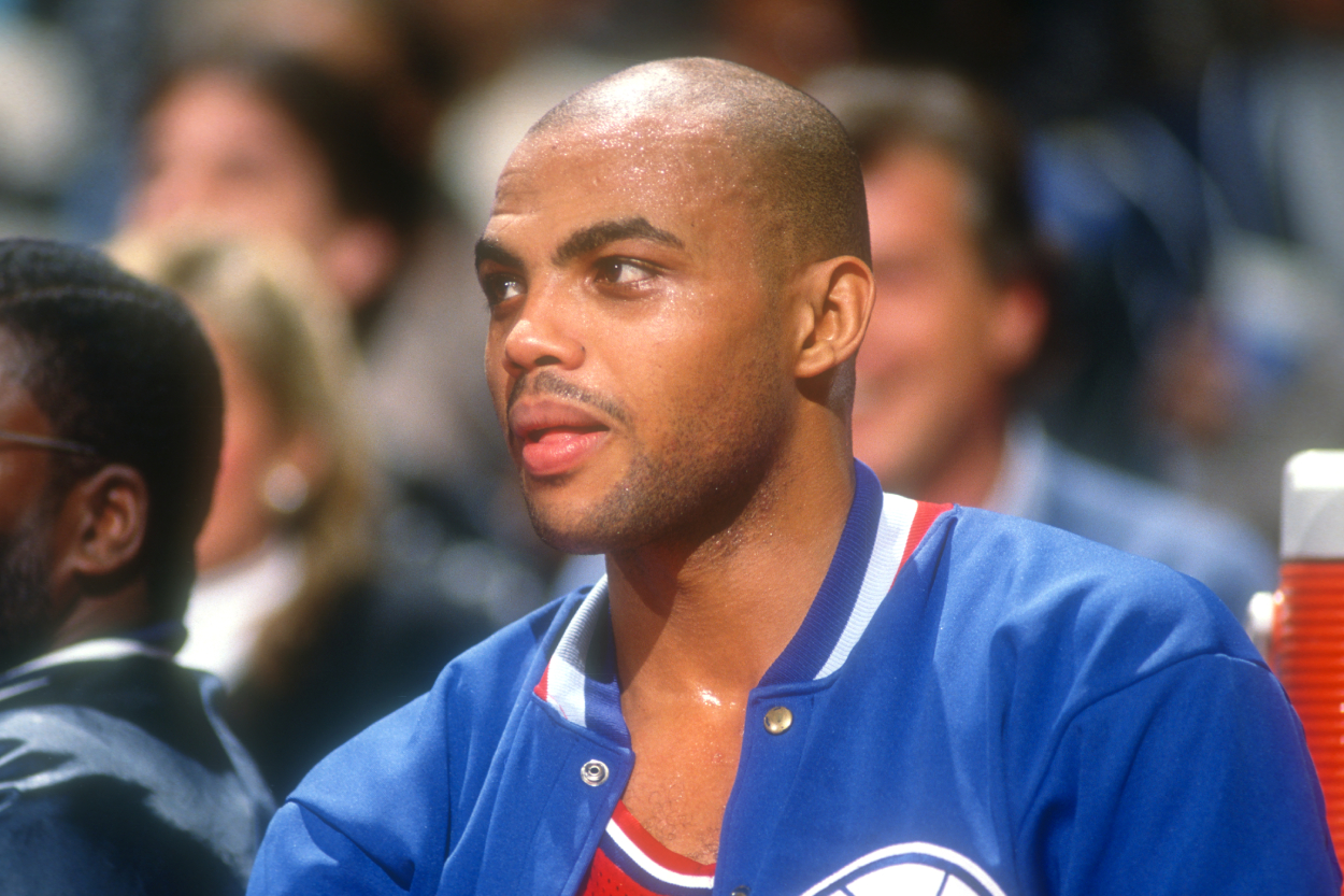 Charles Barkley of the Philadelphia 76ers looks on from the bench.