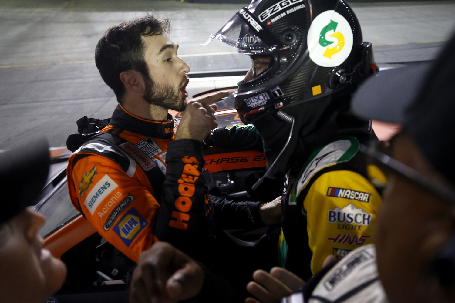 Chase Elliott and Kevin Harvick, have a heated conversation after an incident late in the NASCAR Cup Series Bass Pro Shops Night Race at Bristol Motor Speedway.