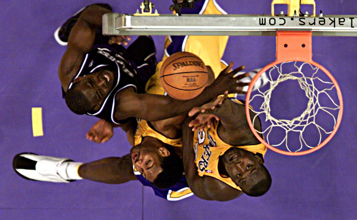 Lakers center Shaquille O'Neal and Kings forward Chris Webber battle for a rebound during the 2002 Western Conference Finals.