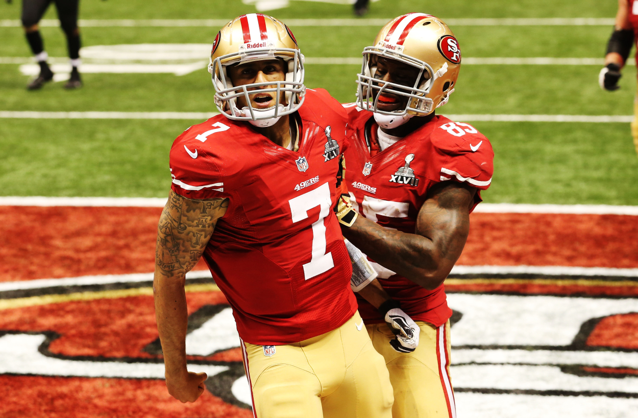 Former NFL players Colin Kaepernick and Vernon Davis playing in Super Bowl 47 with the 49ers.