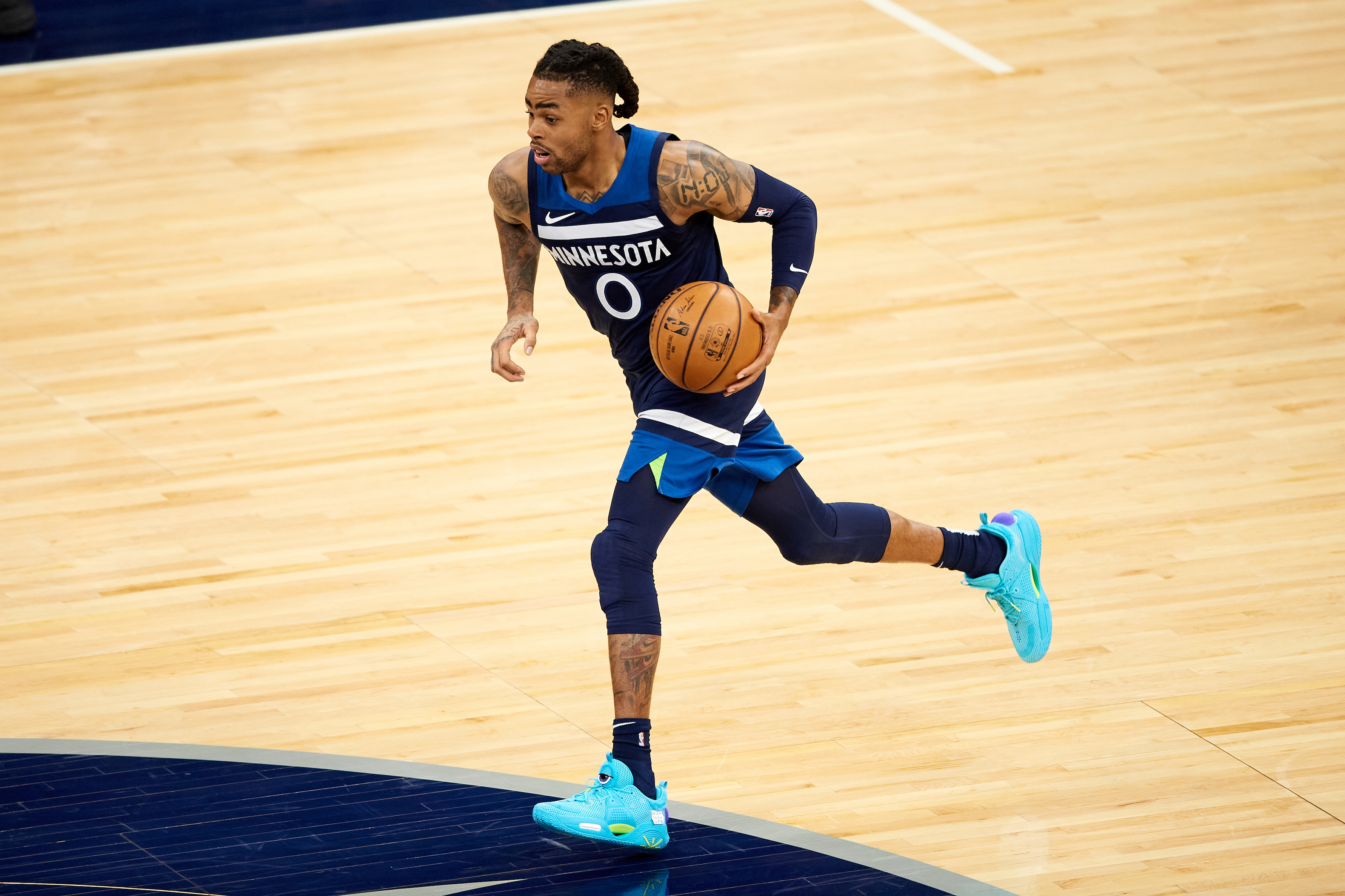 Timberwolves guard D'Angelo Russell dribbles up the floor during a game in April