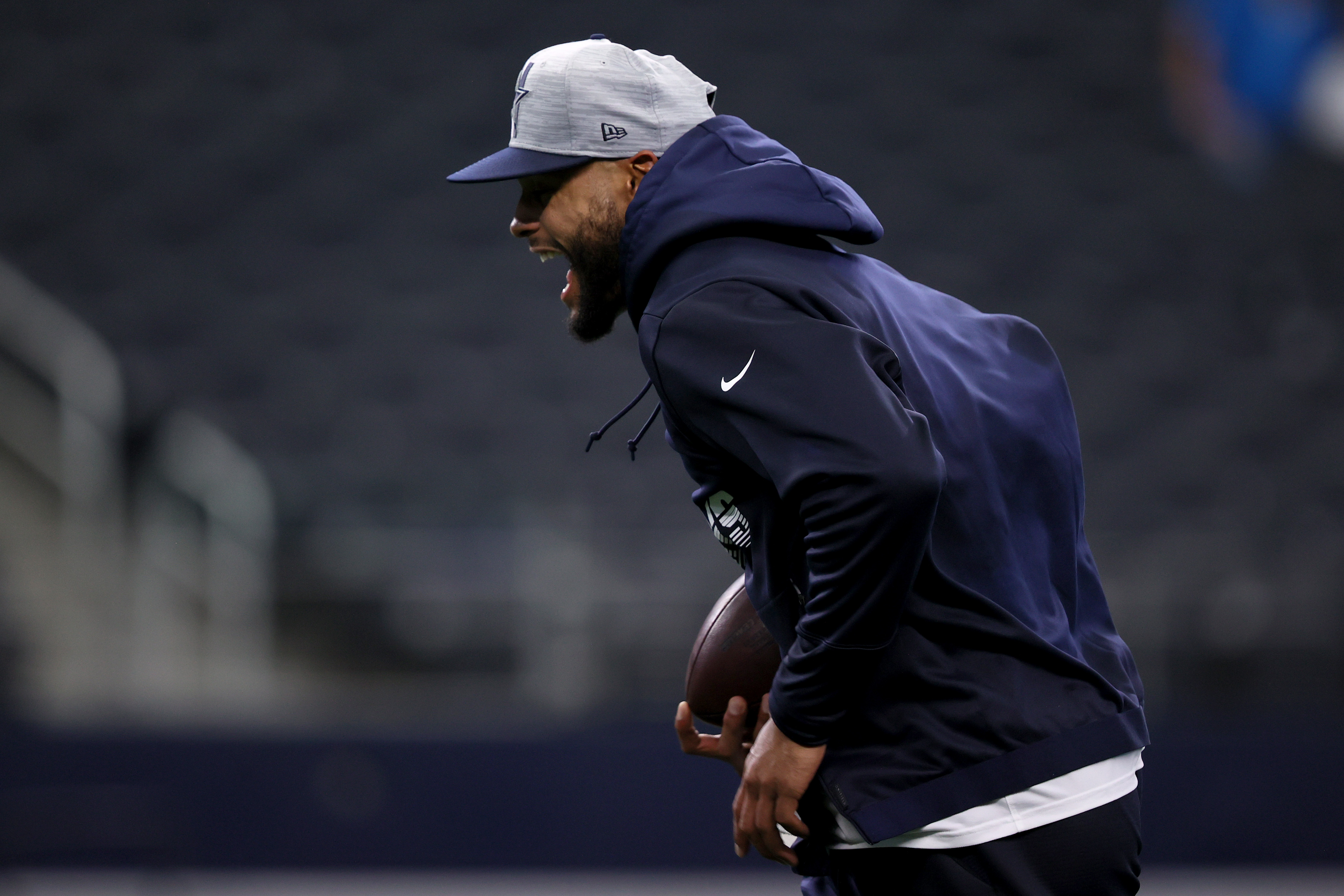 Dak Prescott running on the field before preseason game
