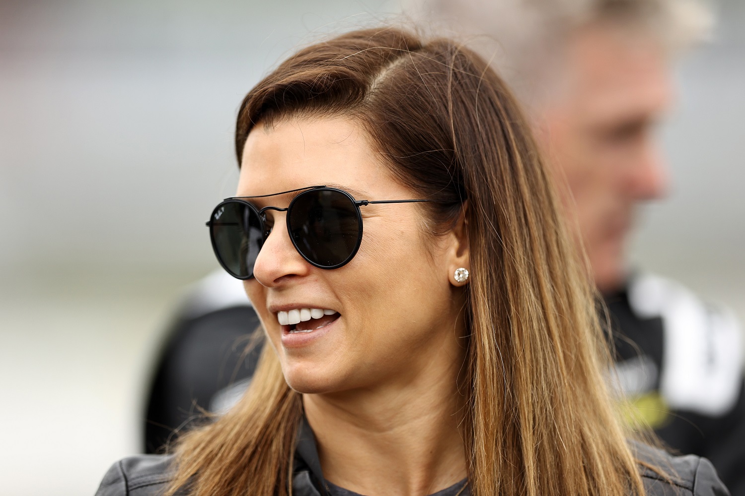 CBS analyst Danica Patrick talks to drivers on the grid during practice for the Inaugural Superstar Racing Experience Event at Stafford Motor Speedway on June 12, 2021, in Stafford Springs, Connecticut. | Elsa/SRX via Getty Images