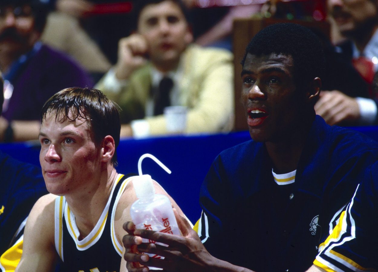 Spurs legend David Robinson sits on the bench during a Navy Midshipmen game