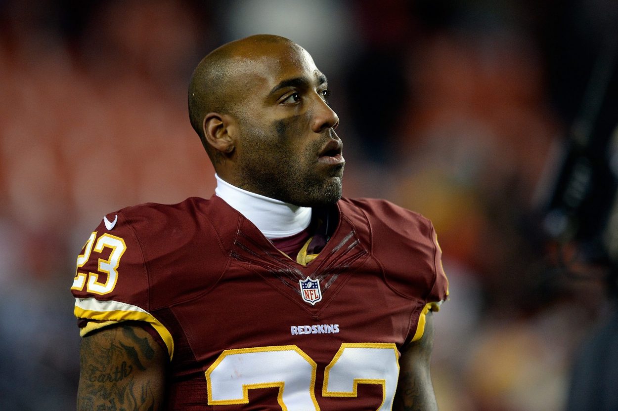 Former Washington cornerback DeAngelo Hall looks at the scoreboard as he walks off the field