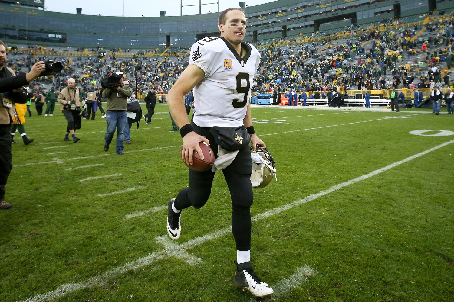 New Orleans Saints quarterback Drew Brees jogs off the field after a road victory against the Green Bay Packers.