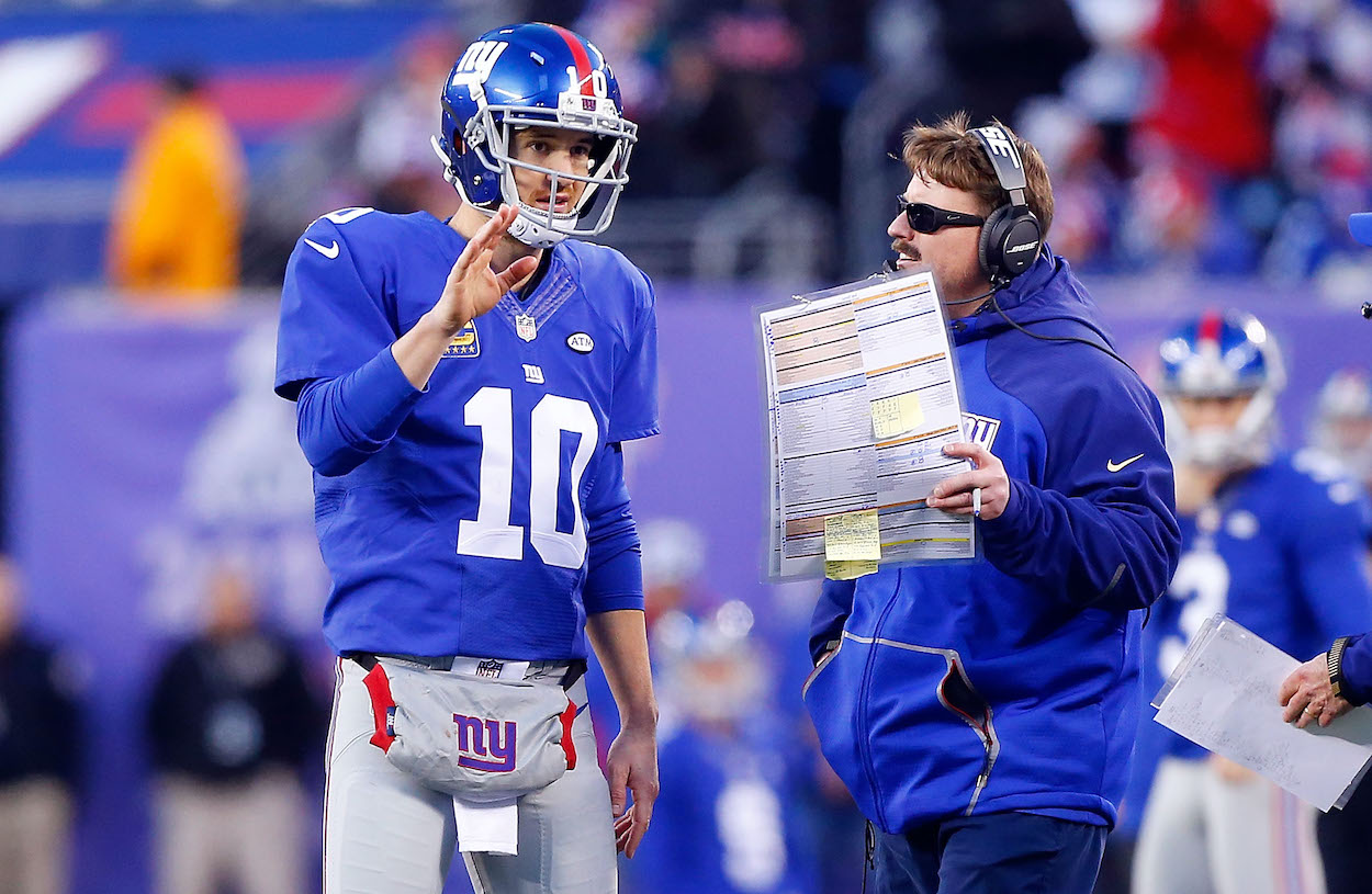 Former New York Giants quarterback Eli Manning is having his jersey retirement ceremony this weekend. He's seen here in 2015 with coach Ben McAdoo.