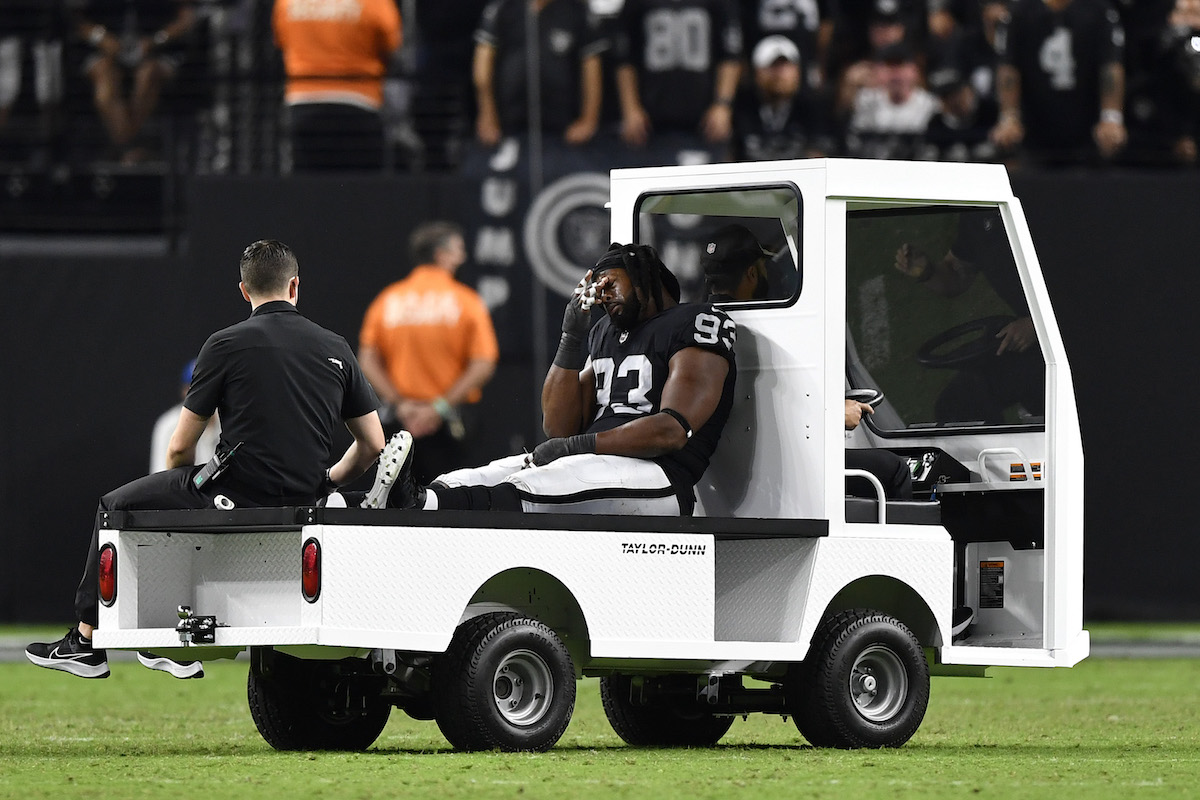 Defensive tackle Gerald McCoy of the Las Vegas Raiders leaves the field after an injury in the second half of a game against the Baltimore Ravens at Allegiant Stadium on September 13, 2021, in Las Vegas