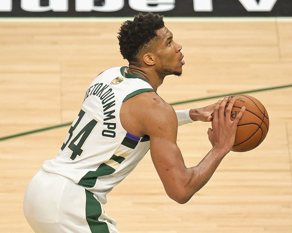 Giannis Antetokounmpo, #34 of the Milwaukee Bucks, shoots a free throw against the Phoenix Suns at Fiserv Forum on July 14, 2021, in Milwaukee, Wisconsin