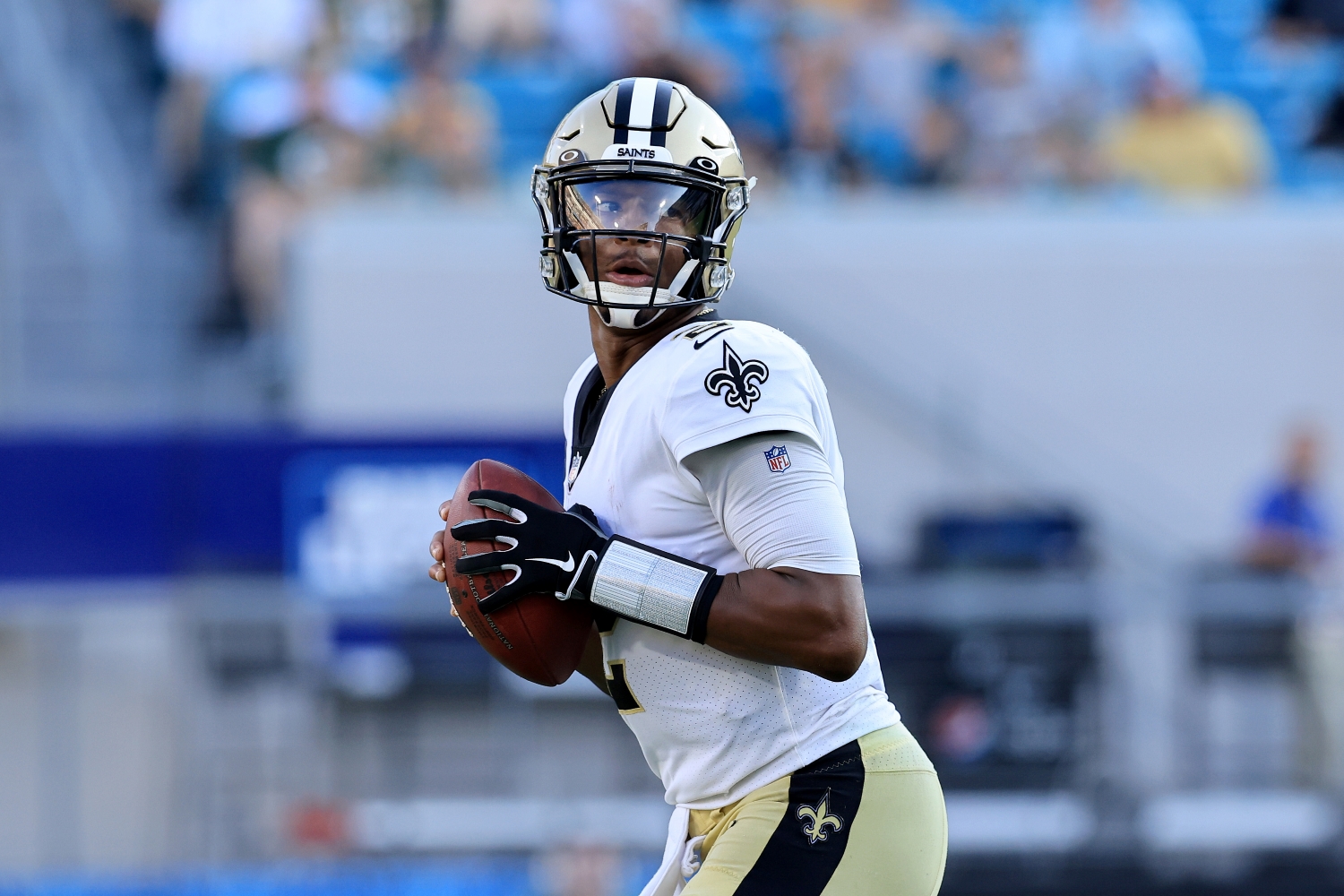 New Orleans Saints quarterback Jameis Winston looks for an open target.