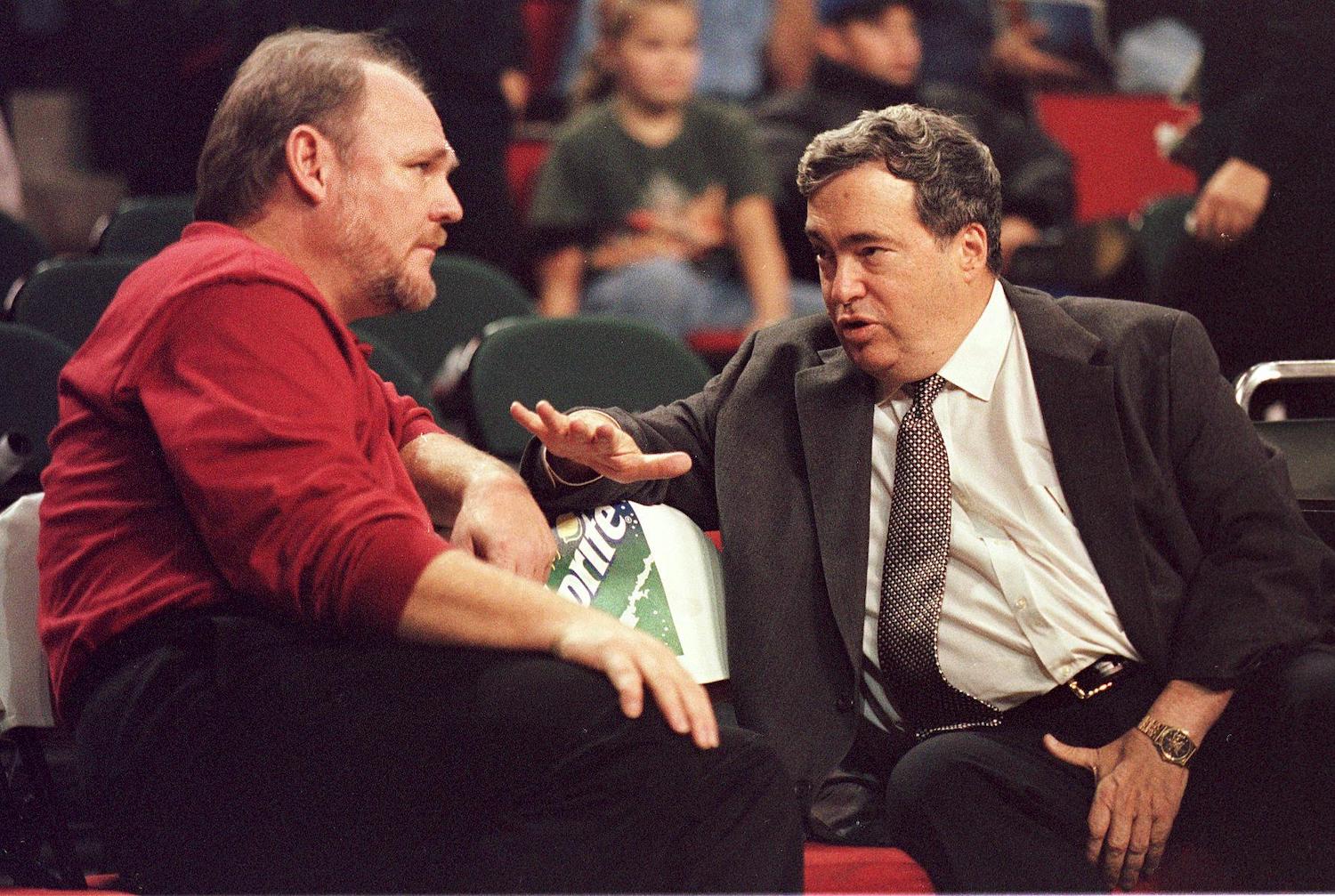 Chicago Bulls general manager Jerry Krause in conversation with then-Seattle Supersonics coach George Karl.