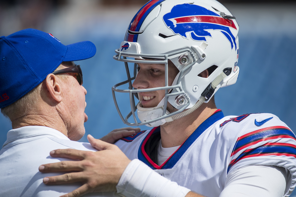Hall of Famer Jim Kelly speaks with Josh Allen of the Buffalo Bills before the game against the Los Angeles Chargers at New Era Field on September 16, 2018 in Orchard Park, New York.